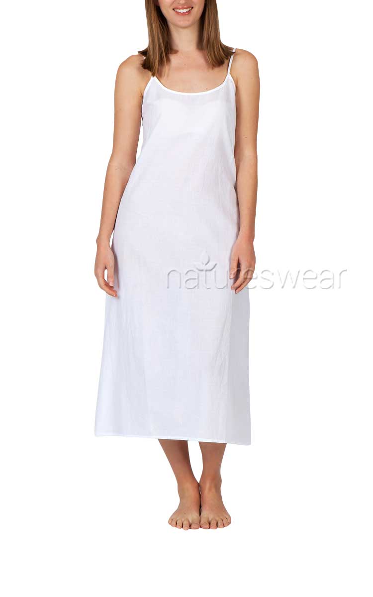 Woman wearing white cotton slip by Arabella