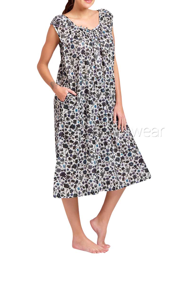 Woman wearing Arabella cotton nightgown in black and floral print with cap sleeve