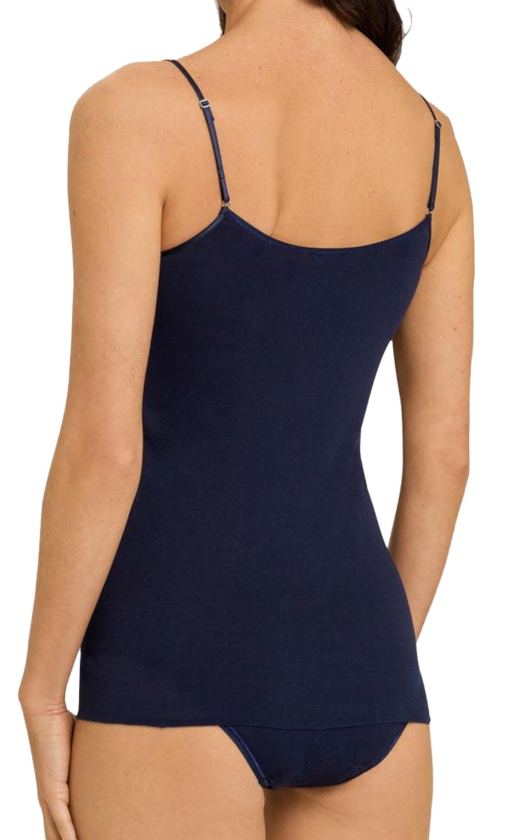 Woman wearing Hanro navy camisole in pure cotton with string straps