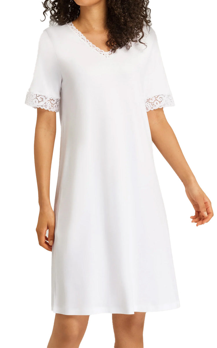 Woman wearing hanro moments nightgown in white