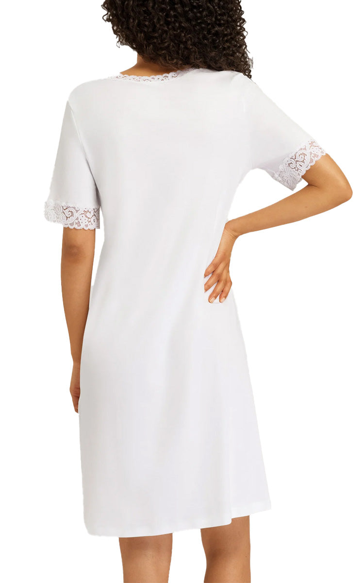 Woman wearing hanro moments nightgown in white