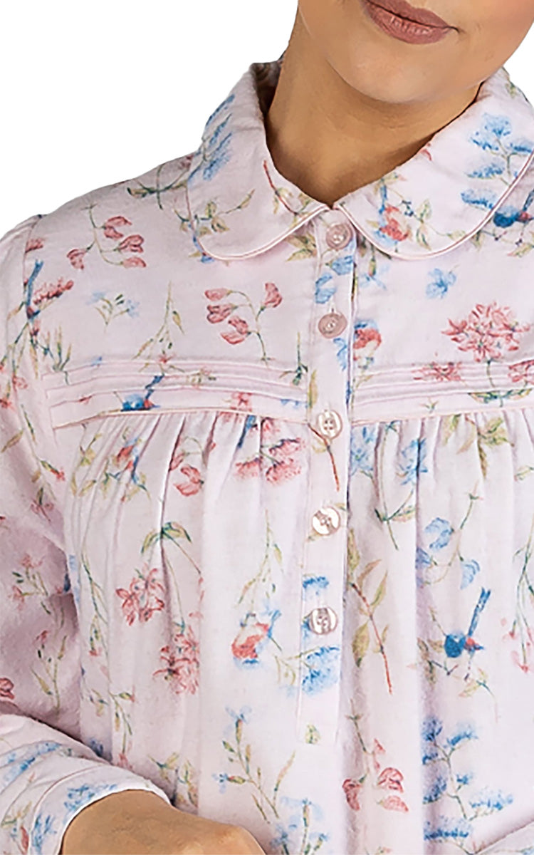 Woman modeling a warm flanelette nightgown for nursing homes 