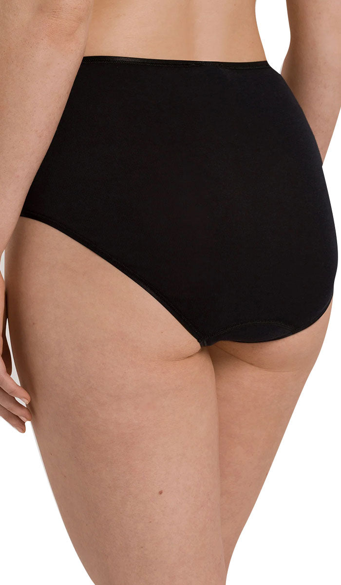 woman wearing Hanro Cotton full brief seamless underwear in black