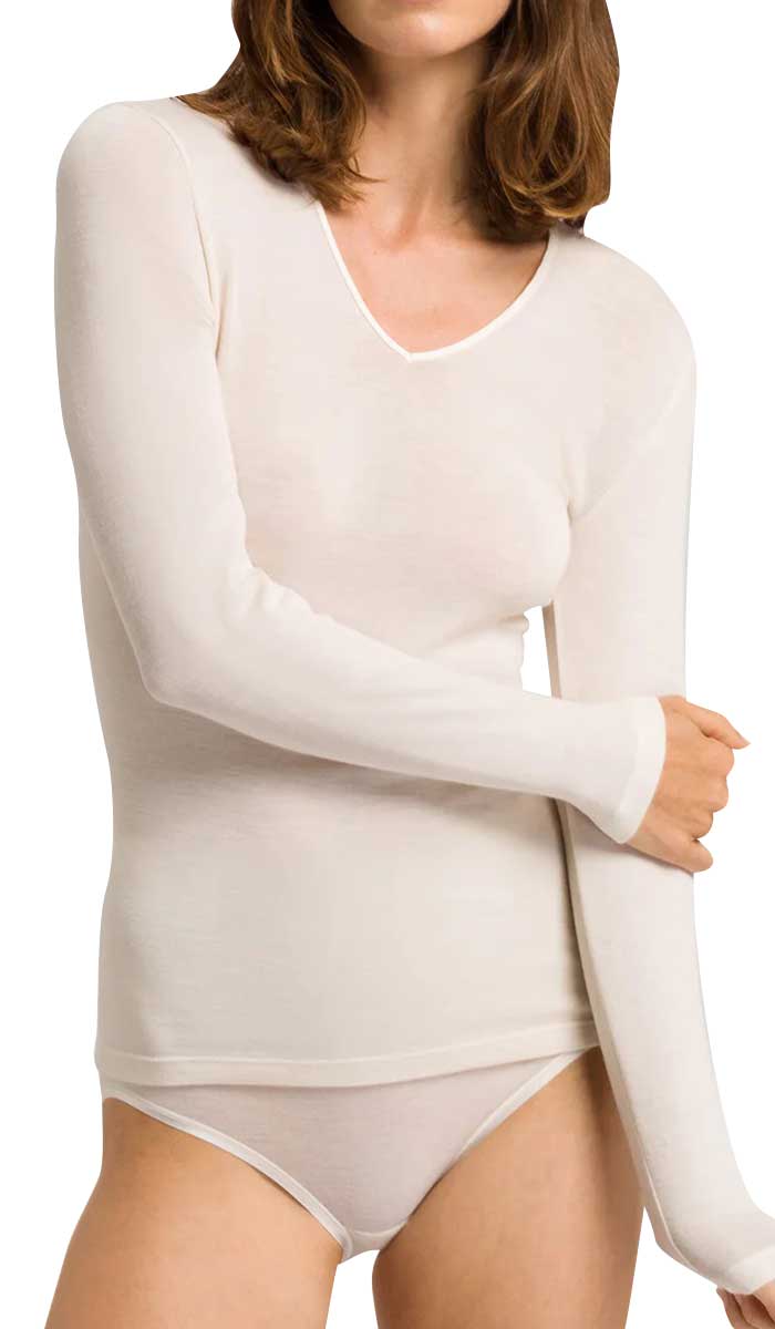 woman wearing hanro long sleeve shirt in ivory