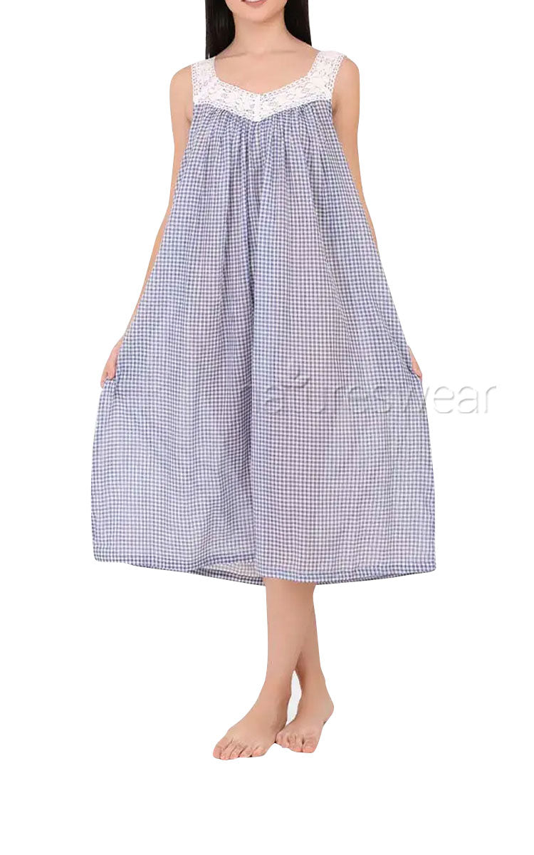 Woman wearing cotton nightie in blue gingham