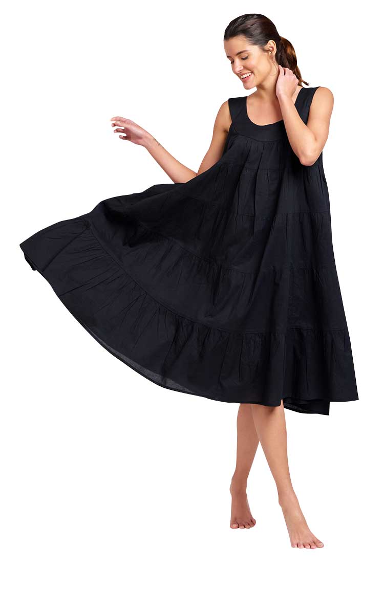 Woman wreaking black cotton sundress by Arabella 