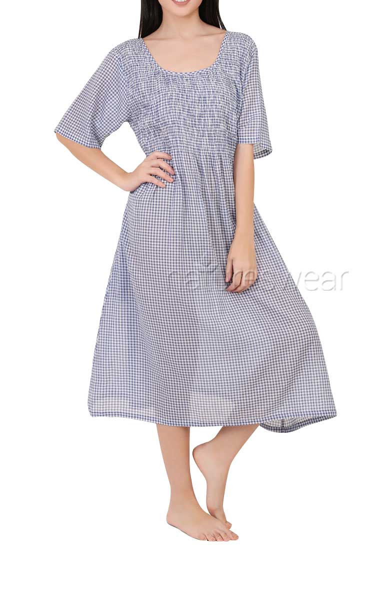 Woman wearing Arabella cotton sundress in gingham print