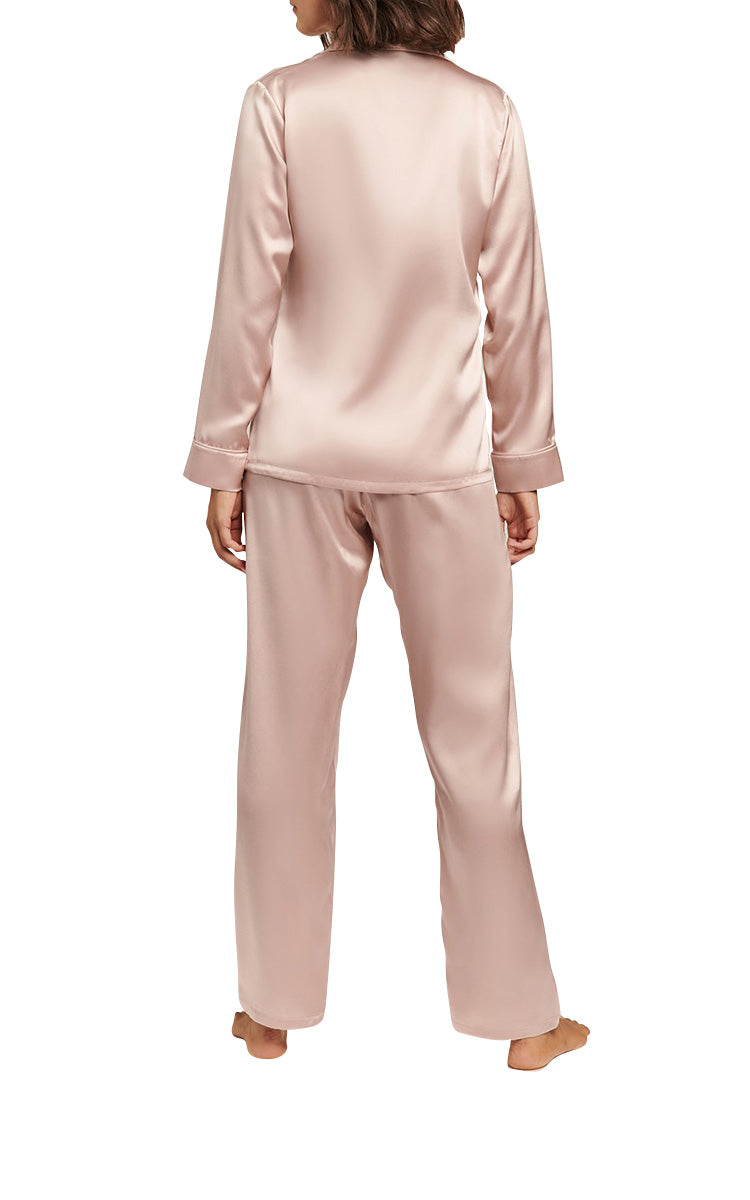 woman wearing Ginia Silk Pyjama In Silver Pink